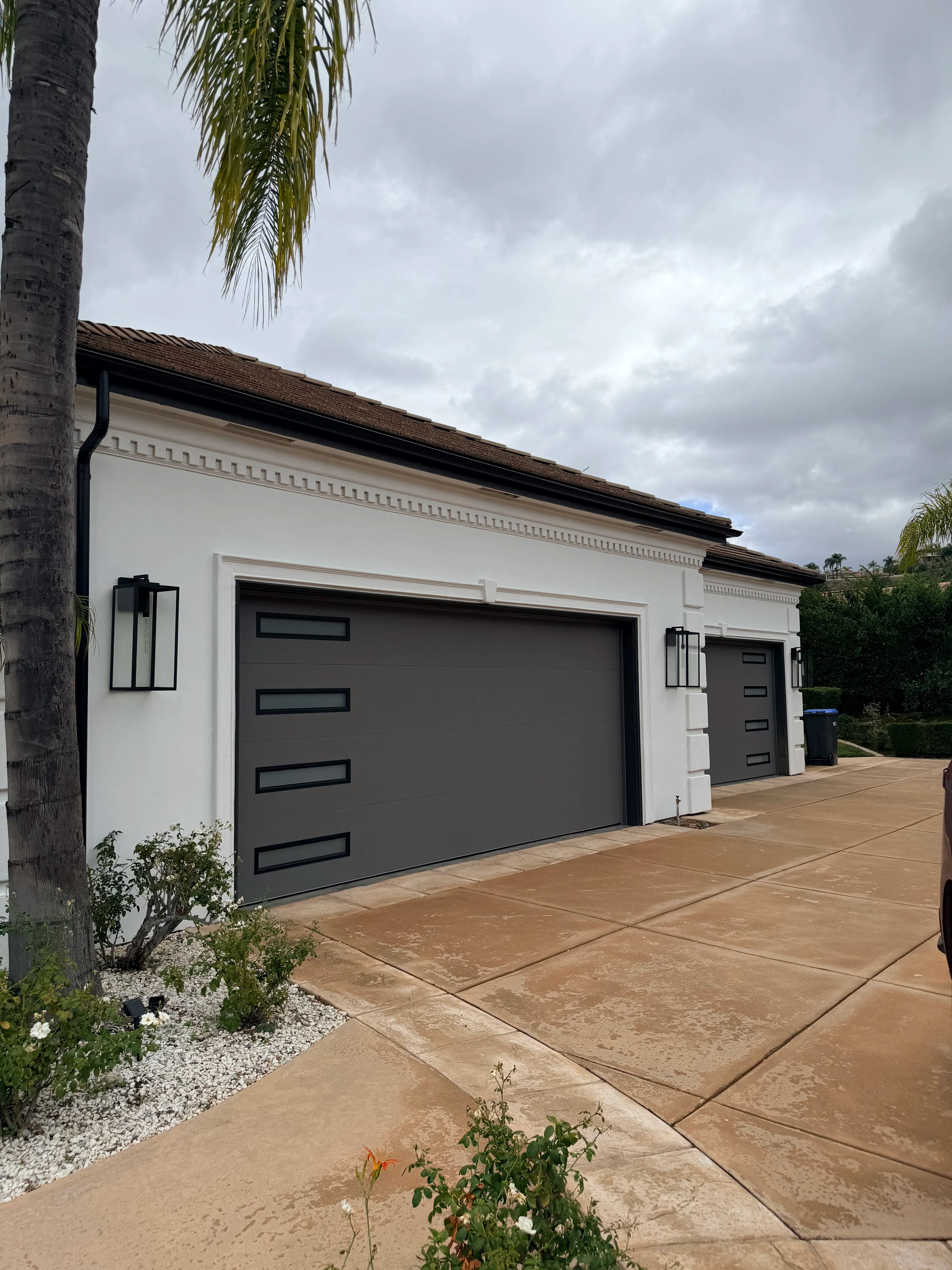 Project Clopay Modern Steel Doors in Lustra Charcoal with Slim Windows image