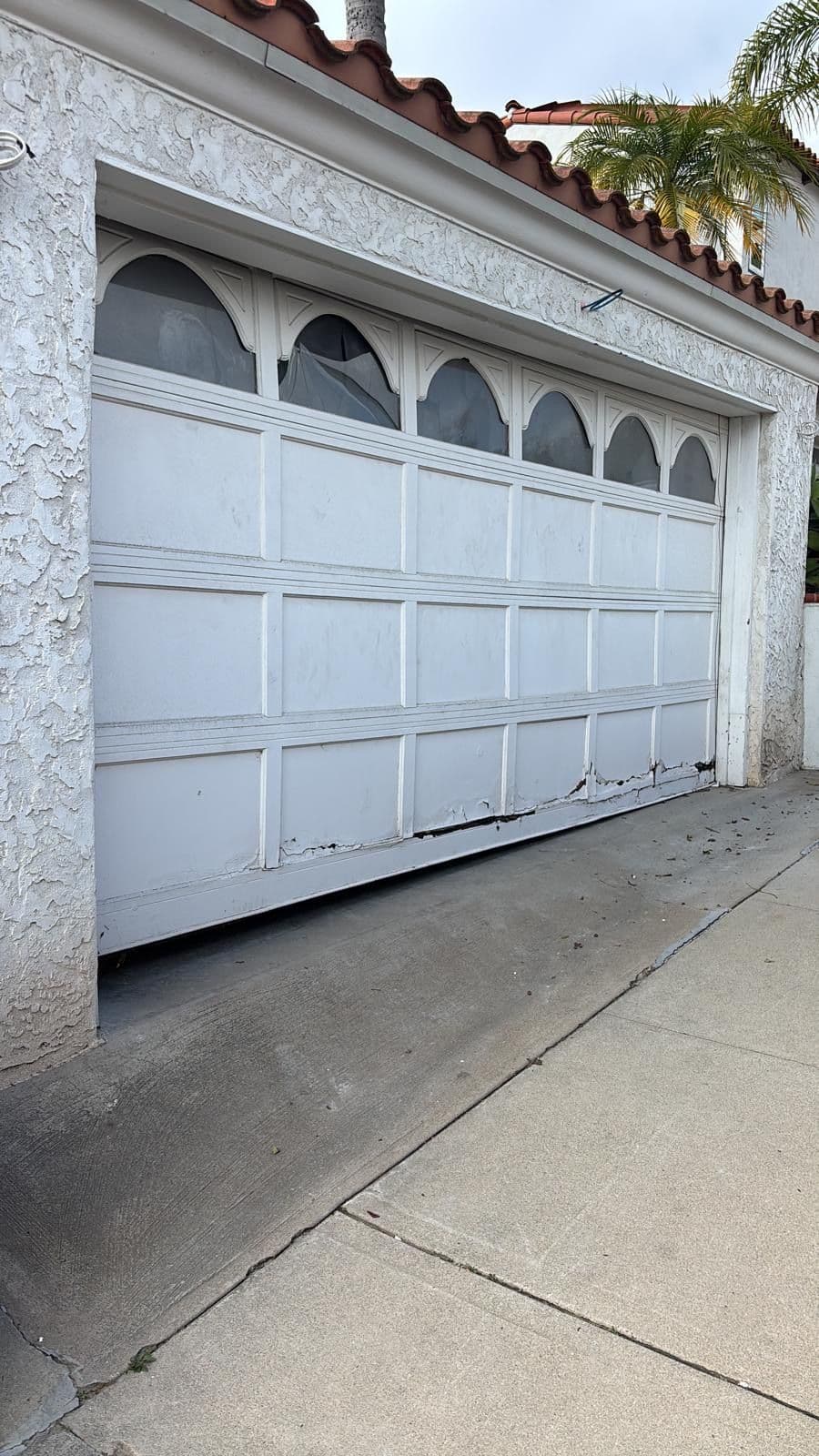 Gallery photos for Damaged Garage Door Replaced With a Sleek Clopay Modern Steel Door: Image #1
