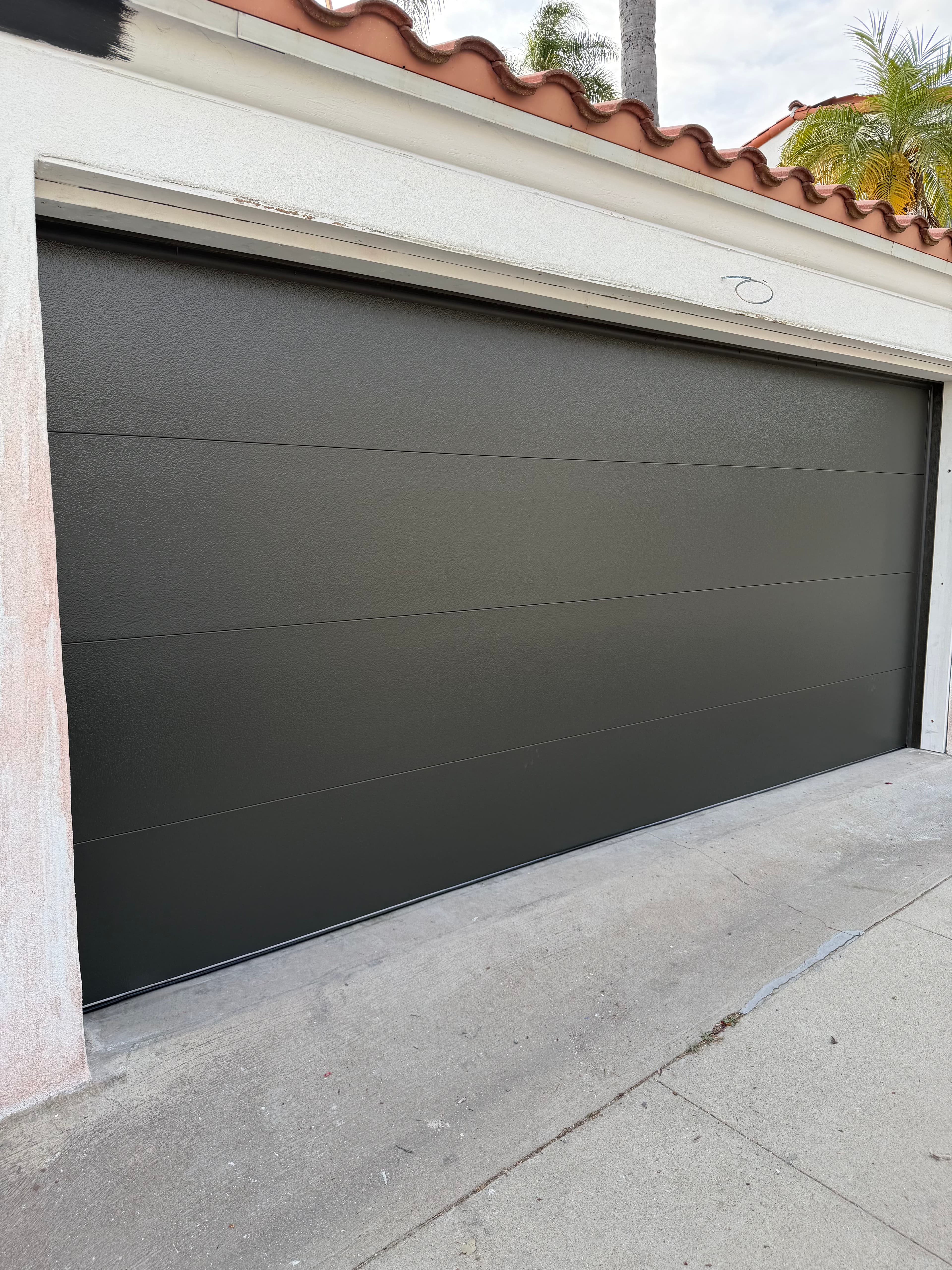 Project Damaged Garage Door Replaced With a Sleek Clopay Modern Steel Door image
