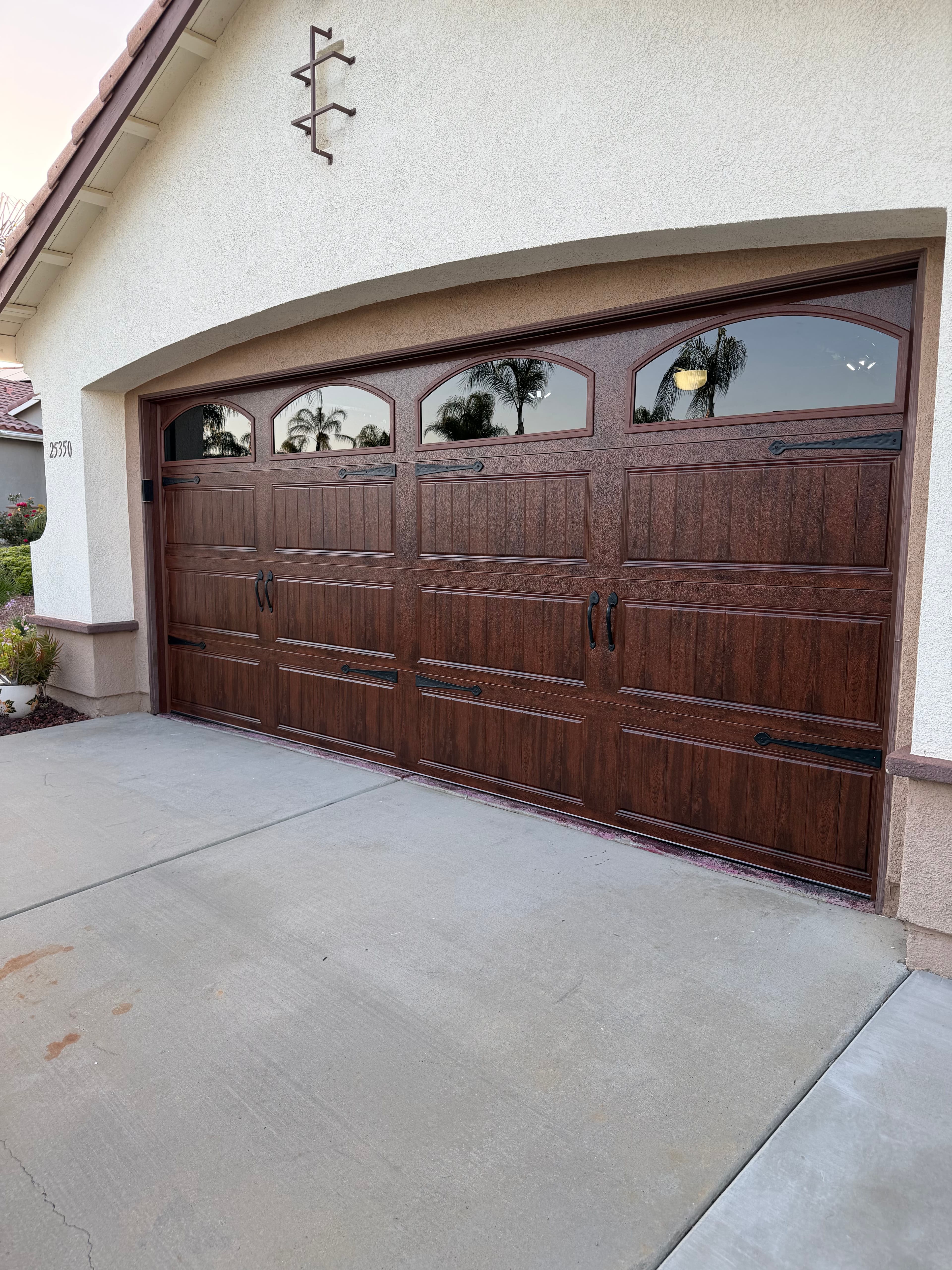 Project Clopay Gallery Walnut Garage Door with Arched Windows image